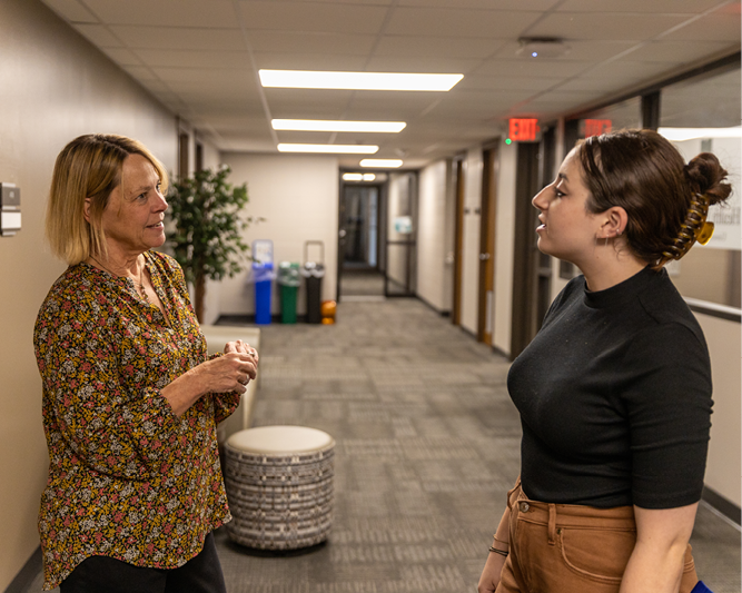 Instructor talking to student.