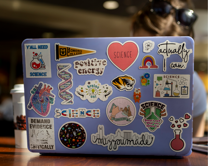 Laptop with stickers.